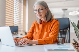 Woman working on her computer remotely.