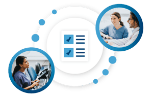 A receptionist and healthcare provider talking at the front desk.